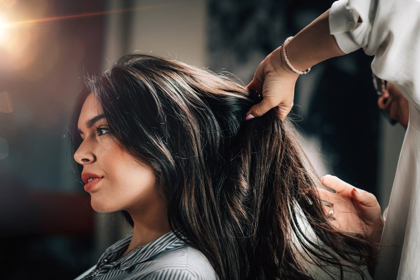Alma Beauty Bar & Spa - Woman getting hair services at beauty spa